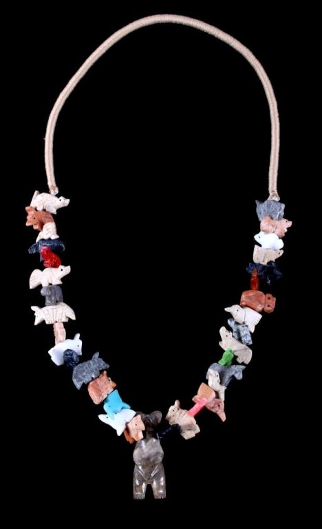 Northwest Coast Indian Carved Animal Necklace: This necklace shows a strands of 34 hand carved animals made of turquoise, pipestone catlinite, spiny shell, soapstone, obsidian, and more. This is a very desirable necklace in excellent condition. Th