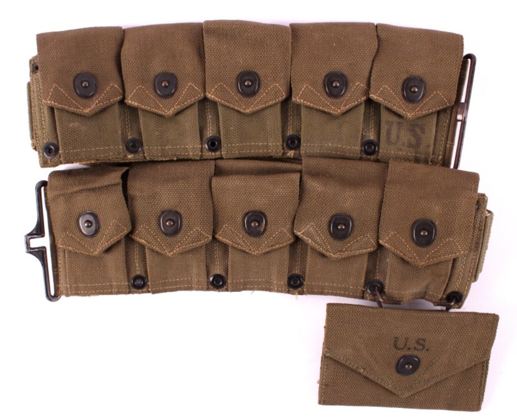WWII M1 Garand Ammunition Belt: This is a WWII M1 Garand ammunition belt. The belt has ten pouches as well as a field dressing pouch. The inside of the belt is marked "Charles 44". The ammunition belt is in very good condition. It m