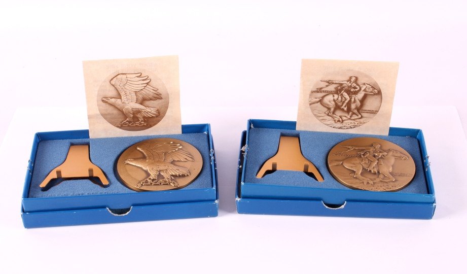 Pony Express and Eagle Bronze Medals: This is a pair of medals made by the Medallic Art Company. They are both made from solid bronze. One shows a Pony Express rider and the other shows a majestic Eagle. They are both marked "MACO 1977". 