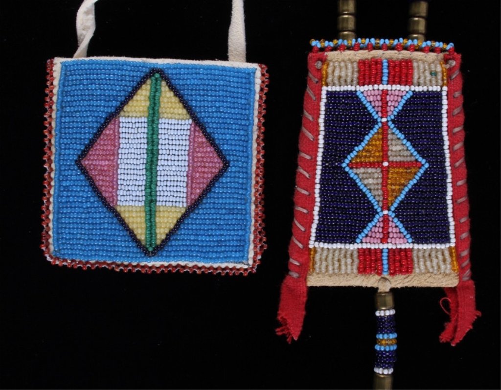 Sioux Beaded Mirror Case & Rations Bag: The lot features two 20th century trade seed beaded bags from the Sioux Native American Indians. The first is a finely beaded mirror case showing a light blue base with Cheyenne pink, greasy yellow, a