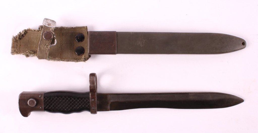 Spanish M1969 CETME Bayonet: This is a Spanish M1969 CETME bayonet. The bayonet is marked with the Toledo coat of arms as well as the INI crest. The bayonet features a unique bolo style blade. The bayonet shows good condition. It