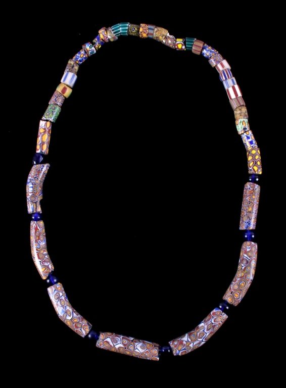 Antique Millefiori Ventian Indian Trade Beads: This is a strand of hand blown Venetian Millefiori & Chevron, Russian cobalt faceted, round pound cobalt, and other early trade beads from the North American Native American Indians. The strand would
