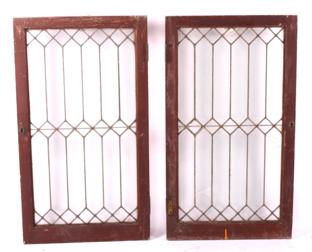 Antique Leaded Gothic Cathedral Glass Windows: This is a pair of antique leaded glass windows. The windows show a Gothic Cathedral style. Each window has a wood frame with over forty pieces of glass. Each piece of glass has been precisely cut and