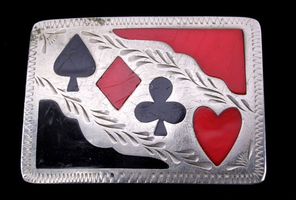 Navajo Silver Card Suit Gamblers Belt Buckle: The piece is from a Navajo Native American Indian silversmith and shows black and red enamel card suit figures. This is a fantastic Gamblers belt buckle in silver. The piece is an antique and shows ov