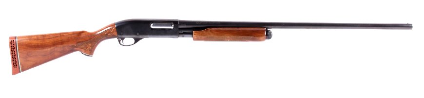 Remington Wingmaster Model 870 12GA Shotgun: This is a Remington Arms Co. Wingmaster Model 870 12 gauge 2 3/4" and smaller shells pump action shotgun. The shotgun has a carved and checkered wood stock and is in overall good condition with rich d