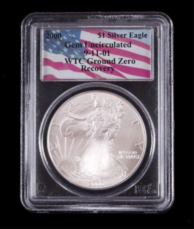 American Silver Eagle WTC Ground Zero 9/11 Coin: This is an original US 2000 American Silver Eagle One Dollar ($1) 1 ounce Fine Pure Silver coin recovered from the World Trade Center Ground Zero. The coins were recovered from the World Trade Center