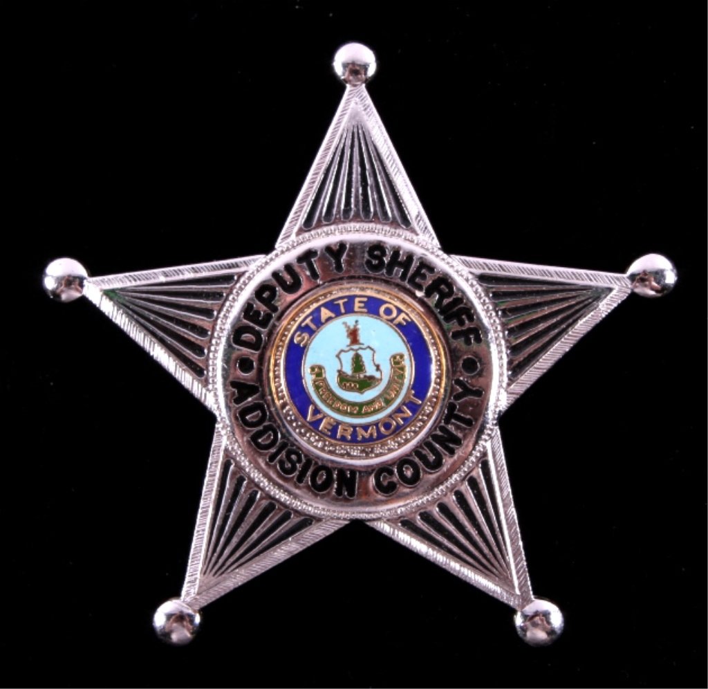 Addison County Vermont Deputy Sheriff Badge: This is a deputy sheriff badge from Addison County, Vermont. The badge shows a five point star with the state seal of Vermont in the center. The badge is in very good condition. It measures 2.5" in di