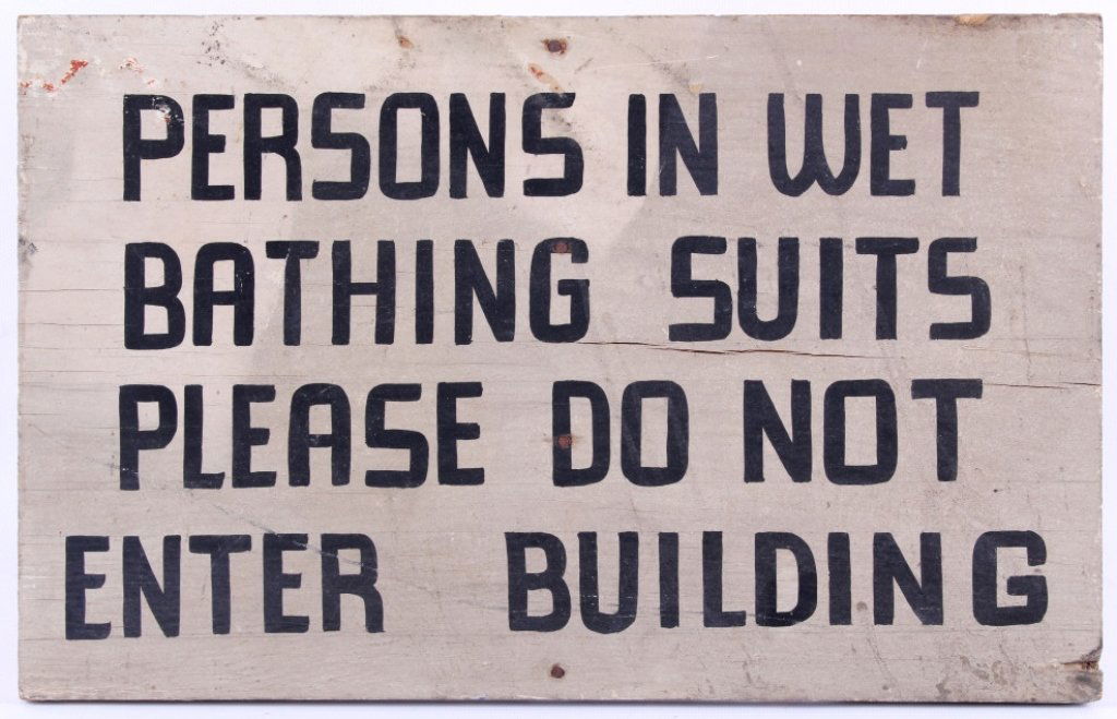 Antique California Boardwalk Wet Bathing Suit Sign: This is a unique hand painted folk art wood sign. The piece is from early 1900 and reads, "Persons in Wet Bathing Suits Please Do Not Enter Building." Hand painted sign. Measures 10"x15 7/8".