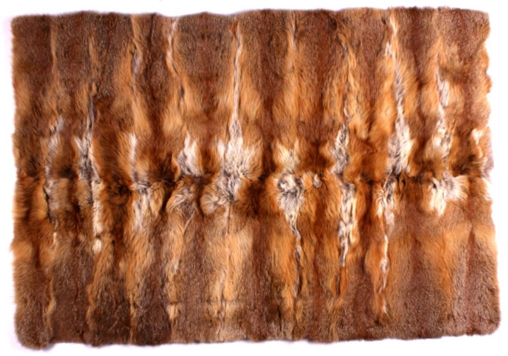 Montana Red Fox Fur Blanket: This is a Montana Red Fox fur blanket. This blanket features 20 fox hides that have been professionally tanned. The hides are perfectly matched and show great color. This is an extremely well made pie