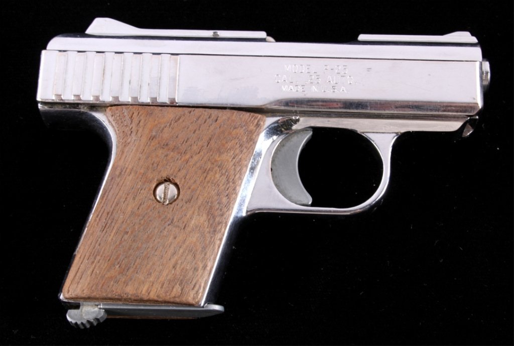 Raven Arms Model P-25 .25 Auto Pistol in Nickel: This is a Raven Arms Industry, CALIF USA Model P-25 semi-automatic pistol in .25 Auto caliber. The pistol is in a bright Nickel finish with wood grips. This comes with one magazine. Serial Number 6302