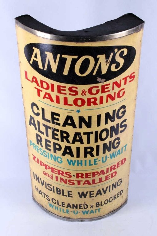 Anton's Tailoring Advertising Sign Early 1900: This is an early 1900 original mercantile Anton's Tailoring & Cleaning advertising sign. The piece shows a painted front with a curved design, most likely displayed on the corner of the building. The 