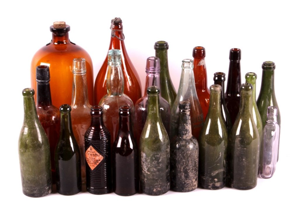 Antique Bottle Collection: This is a collection of 22 antique glass bottles. Included in this collection are beer, wine, whiskey, soda, and apothecary bottles. They are from the late 1800's to early 1900's. They are in good ove