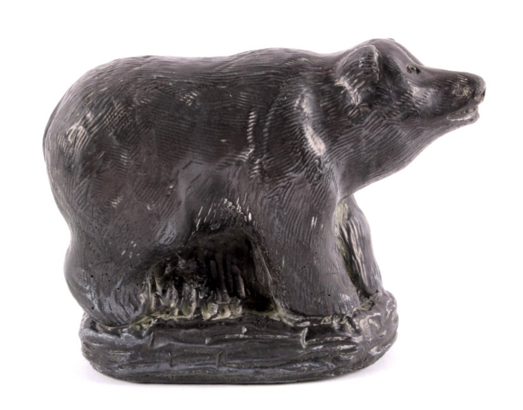 Eskimo Inuit Bear Soap Stone Carving c. 1914: The piece shows a carved Alaskan Grizzly Bear from a Eskimo Inuit Native American Indian. The piece is signed across the bottom, "AGASU 1914" and is carved from green soapstone. The piece shows overal