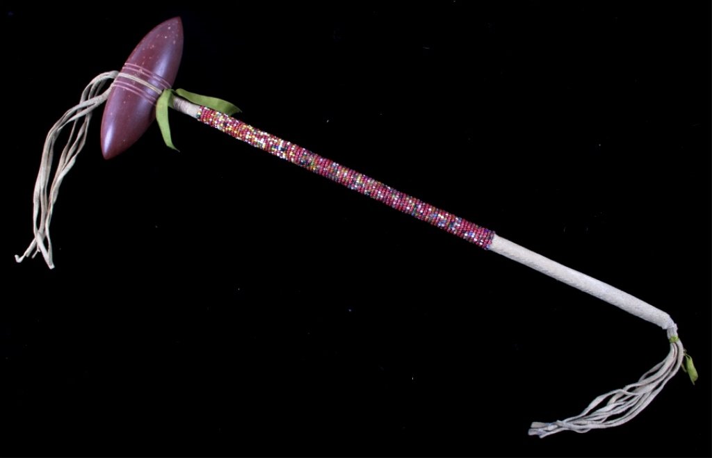 Meskwaki Beaded Catlinite War Club 1900-1950: This is a Meskwaki (Mesquaki) pipestone or catlinite full beaded handle war club. The piece is from the mid to early 1900's and shows overall good condition. The early glass trade seed beads show an e