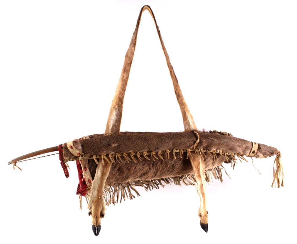 Apache Bow & Beaded Bow Arrow Quiver 1870-1880: This is a 19th century bow and arrow quiver with carved wood bow from the Apache Native American Indians. The piece is an exceedingly rare style with all deer fur hide and hanging deer hoof tassels. T