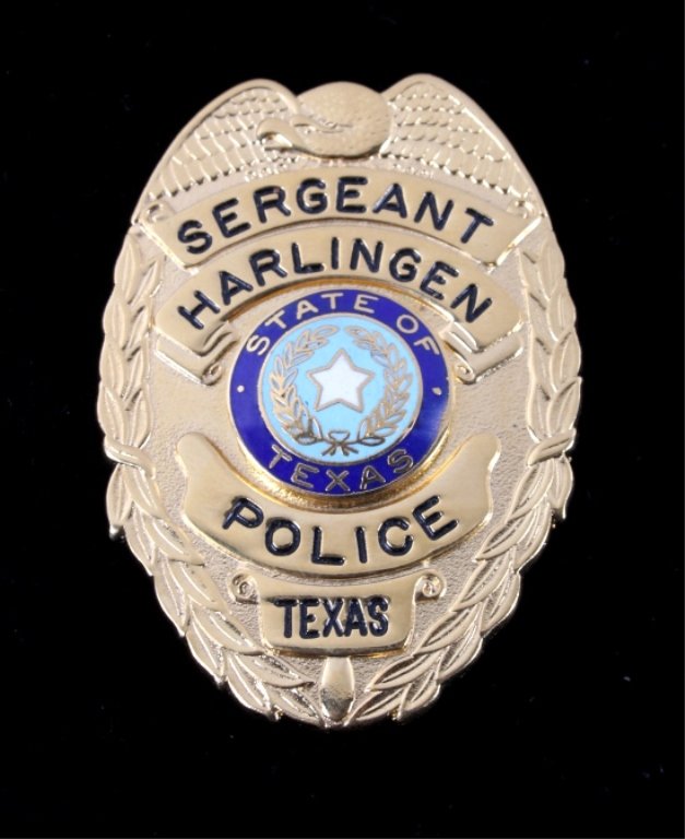 Texas Harlingen Sereant Police Badge: This is a vintage Harlingen State of Texas Sergeant Police Badge. The badge shows a brass colored construction with enameled State of Texas seal and black enamel lettering. The badge shows the eagle a