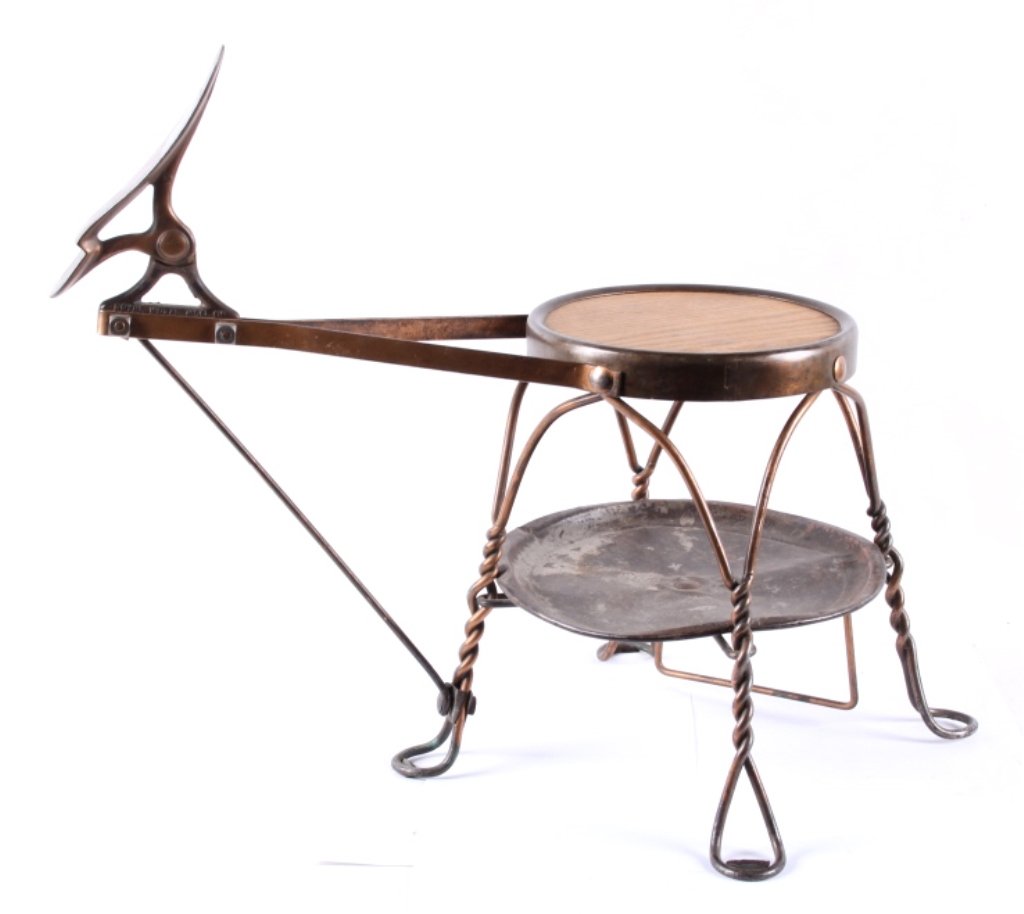 Antique Royal Metal MFG Shoe Shine Stool: This is an antique wrought iron with a copper wash shoe shining stool made by Royal Metal MFG. The early 1900 to 19th century piece shows overal good condition. The piece has a wrought iron twisted ic