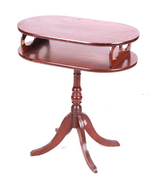 Antique Oval Mahogany Lamp Table: This is an antique lamp table. The table is made from solid mahogany with Duncan Phyfe style legs. The lamp table is in good condition. It measures 13" x 23" and is 26.25" tall.