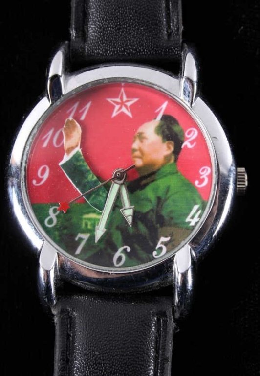 Chinese Communist Party Chairman Mao Watch: This is an original Chinese Communist Party Chairman Mao waving arm automatic wrist watch. The watch has a polished cast and 5 to 7 jewel movement that does work. The Chairman's arm waves by the secon