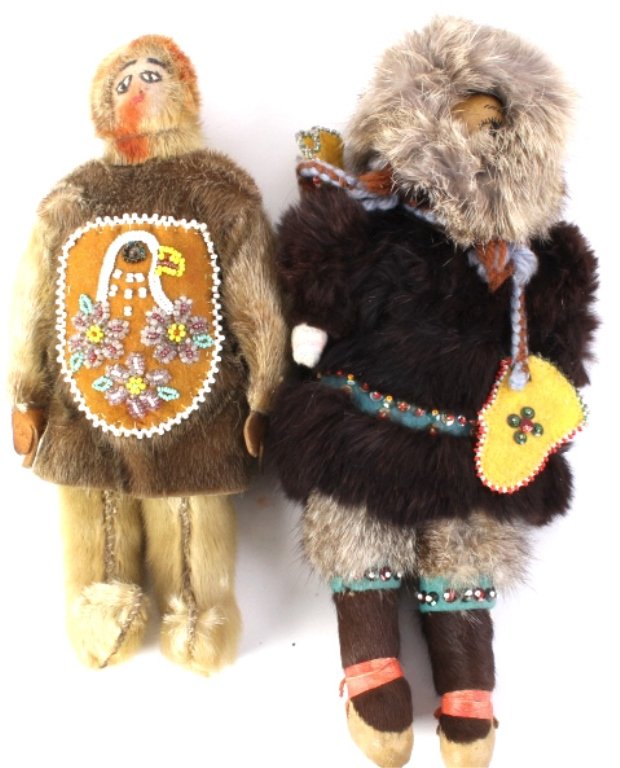 Eskimo Inuit Seal Skin and Hide Dolls: Rare seal skin with beaded pictorial motif across the center depicting an eagle and three flowers (1940-1960). The other shows various hides including: wolf, moose, and beaver measures 9" x 4" and 11 