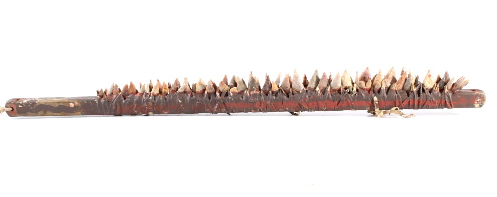 Northern Plains Arrowhead Teeth War Club: The piece features dozens of original arrowheads rawhide wrapped and modernly re-glued to the wood shaft with a Northern Plains Indian appearance. The age of the piece is unknown, but it has a fantast