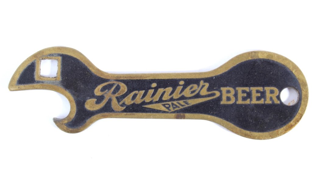 Rainier Pale Beer Brass Bottle Opener 1930: This is an original Seattle, Washington Rainier Pale Beer brass bottle opener from the 1930's. The opener is brass with an incuse black background and embossed brass lettering. The piece is in very go