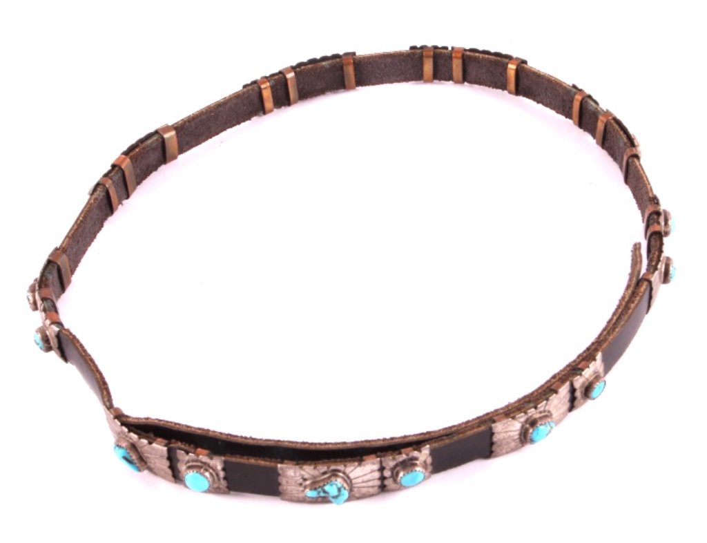 Navajo Sterling Silver and Turquoise Hat Band: This is a Navajo sterling silver and turquoise hat band. The hat band is composed of 9 sets of sterling silver conchos. Each of the conchos shows beautiful hand tooled workmanship on the silver with a