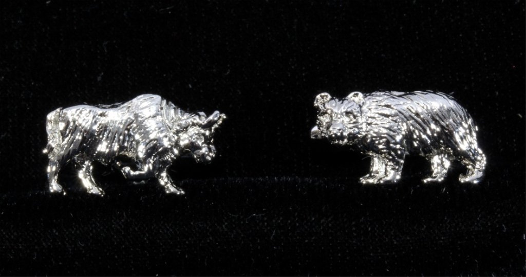 Tiffany Sterling Silver Bull & Bear Cufflinks: The lot features a set of Bull & Bear Stock Market theme men's sterling silver cufflinks made by Tiffany and Co. The pieces are both hallmarked, "T & CO .925". These are in a jewelry box and both in v