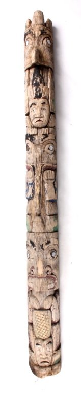 Northwest Coast Carved Wooden Totem Pole: This is a Northwest Coast carved wooden totem pole. The totem is an expression of the coastal people that depicts family, animals, spirituality, etc. This totem shows many figures including human, bir