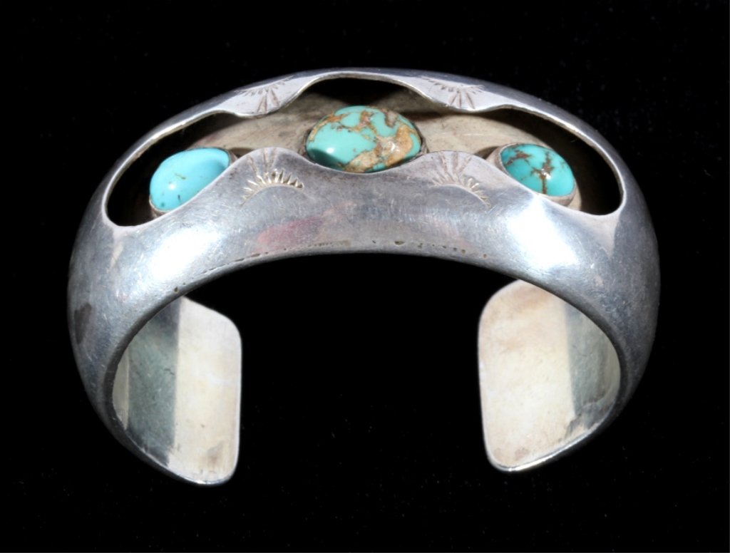 Navajo Turquoise Silver Shadow Box Tepee Cuff 1930: This is an excellent early Navajo Native American Indian bracelet or cuff showing a shadow design with three excellent gem quality Turquoise stones. The piece is from circa 1930's and shows a heavy st