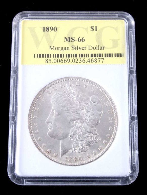 1890 Morgan Silver Dollar MS-66 Graded: This is a Morgan Silver Dollar minted in Philadelphia 1890. The piece has been graded and hermetically sealed by WCG (World Coin Grading). This is a very high graded coin at Mint State 66. Bright Whit