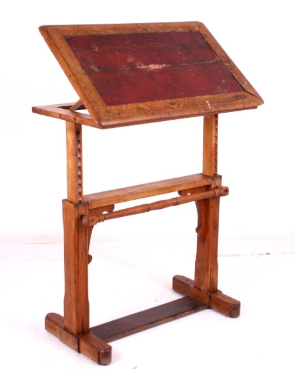 Antique Oak Drafting Table: This is an antique oak drafting table. The table features a tilting top. In addition, the top can be raised and lowered. The drafting table is in good overall condition. It measures 33.5" wide and 20.