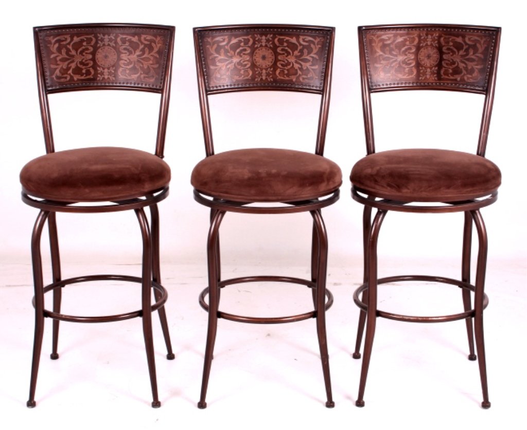 Rustic Style Stamped Barstools: This is a set of three rustic style stamped barstools. Each barstool features a wonderful stamped riveted design and has a leather upholstered seat. The barstools are in good condition. They measure 1