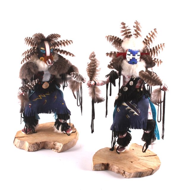Navajo Native American Kachinas: This is a pair of Navajo kachinas. One is titled "Snow Dancer" and the other is titled "Badger". Both are hand crafted and have been signed on the bottom by the artist. They are in good condition. Eac