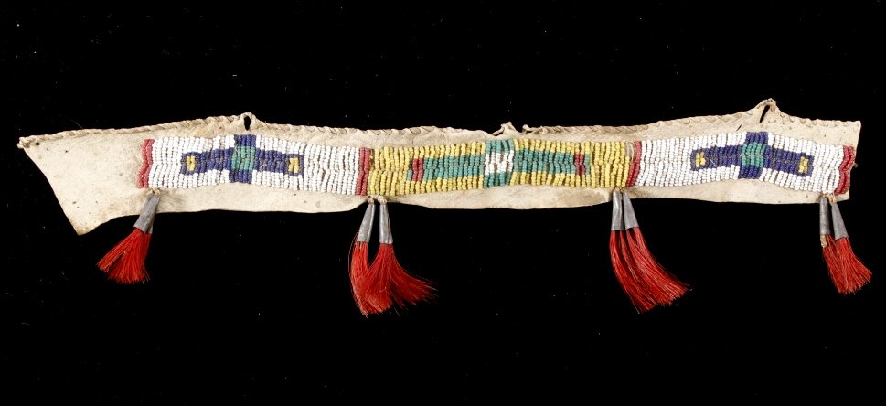 Crow Beaded Bridle Foretop circa 1880: This is an early Crow Native American Indian beaded horse’s bridle foretop from circa 1880. The piece was recovered at Pryor Creek in the 1930’s (per the tag info) and is from the Pryor Museum. Th