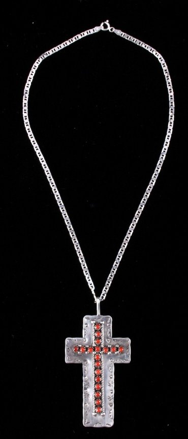 Zuni Signed Sterling Silver and Coral Cross: This is a Zuni sterling silver and coral cross pendant with necklace. The cross features a hand tooled design around the border with wonderful coral stones set in the center. The back of the cross is