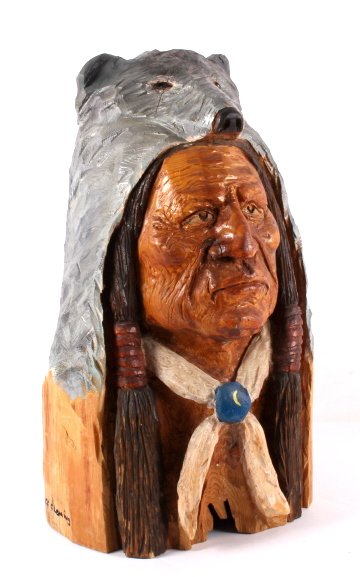 Native American Chainsaw Carving by Jeff Fleming: This is an original Native American warrior bust chainsaw carving by Montana artist Jeff Fleming. The warrior is shown in a wolf cape headdress. The carving shows incredible detail and craftsmanship. 