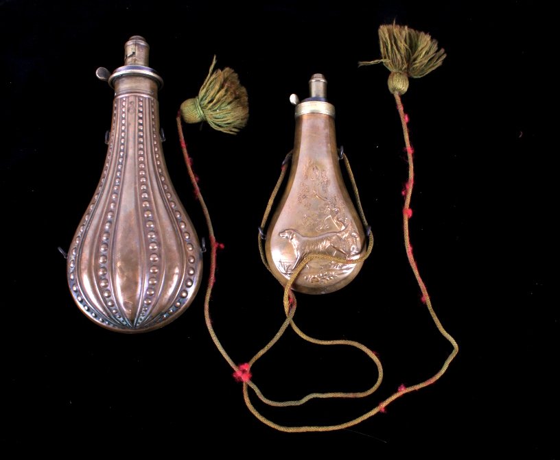 Antique Set Of James Dixon & Sons Powder Flasks: This lot features a set of two James Dixon and Sons of Sheffield powder flasks. First in this lot is the James Dixon and Sons of Sheffield quick loading fire proof marked flasks. It is constructed of 