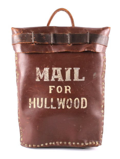 Antique Leather Mail Bag with Lock and Key: This is an antique leather mail bag with lock and key. The bag is marked "Mail for Hullwood" and is believed to be from Montana. Hullwood was likely an early stagecoach or train stop. The padlock is m