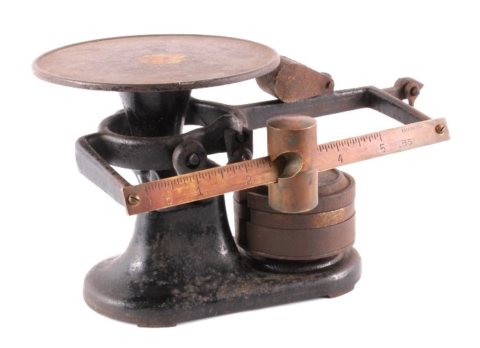 Antique Fairbanks Cast Iron Balance Scale: This is an antique Fairbanks cast iron balance beam scale. The scale. The scale features a brass slide and comes with a full set of weights. The scale also has a weight that can be engaged when using