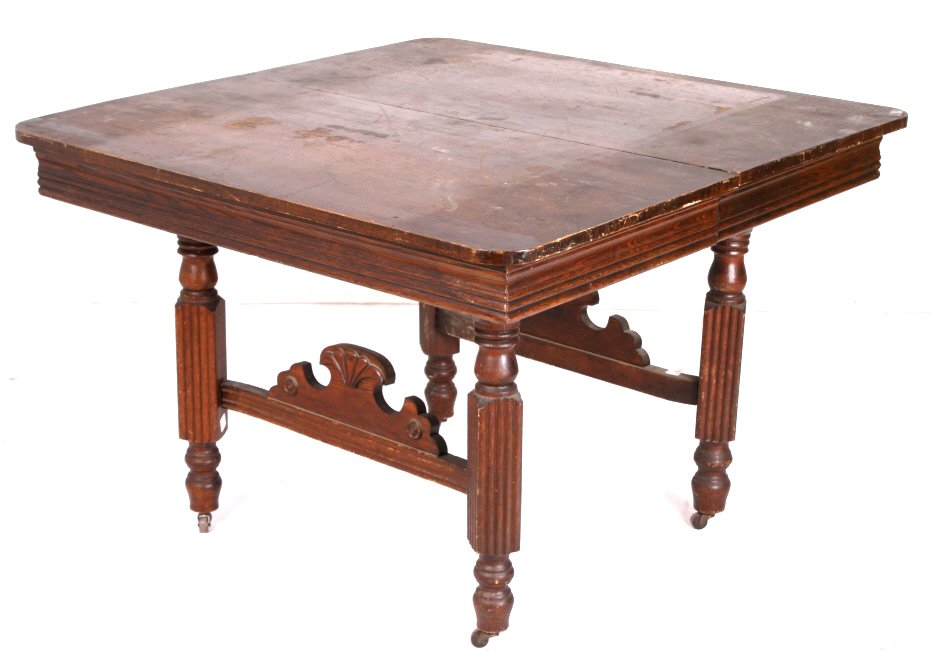 Antique Square Oak Table: This is a Duncan Phyfe Dining Room Table from the 1930's. The piece shows excellent carved melon stands with brass feet. The table shows a Mahogany wood and veneer construction with signs of use. Top