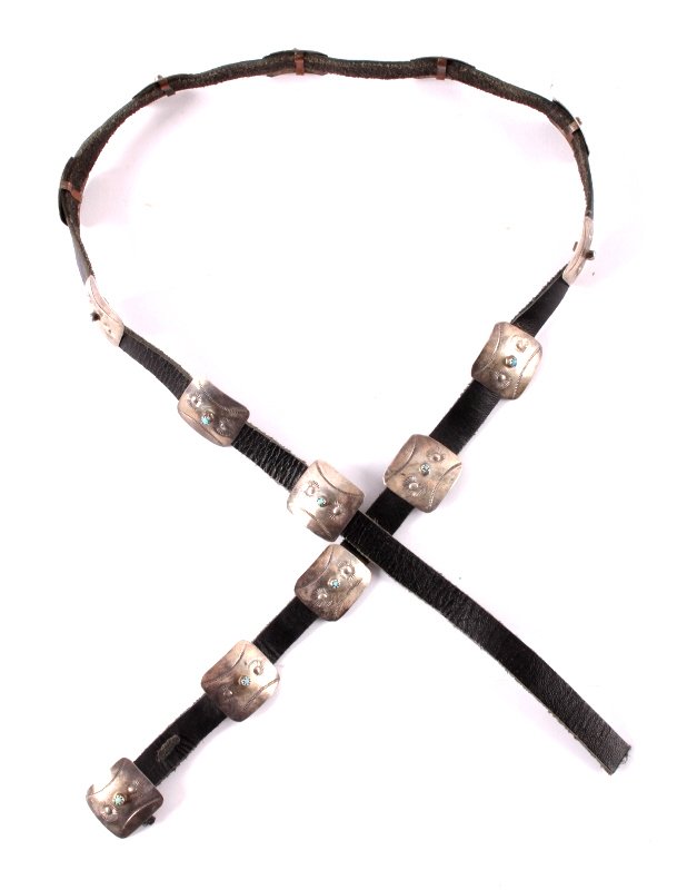 Navajo Sterling Silver Concho Belt: This is a Navajo sterling silver and turquoise concho belt. The belt features 13 hand tooled silver conchos, each one is set with a turquoise stone. The Navajo concho belt is in good condition. Each c