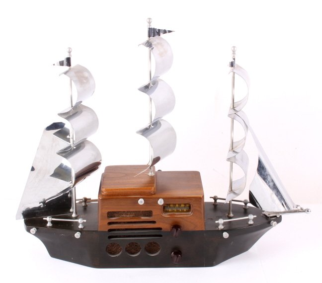 1940's Majestic Melody Clipper Ship Tube Radio: This is a 1940's Majestic Melody clipper ship tube radio. The ship is made from solid wood and metal sails with chrome finish. The ship has an AM radio that features a 5 tube chassis that can be acces
