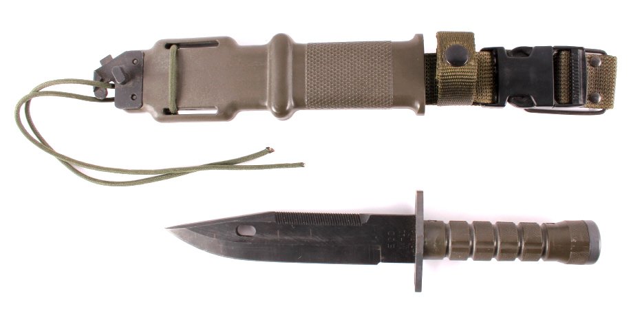 US Army EOD M-11 Lan-Cay Utility Knife & Scabbard: This is a U.S. Army EOD (Explosive Ordnance Disposal) M-11 Lan-Cay utility knife and scabbard. The knife is marked "EOD M-11 Lan-Cay" and was designed for use by the 52nd Ordnance Group. The knife is 