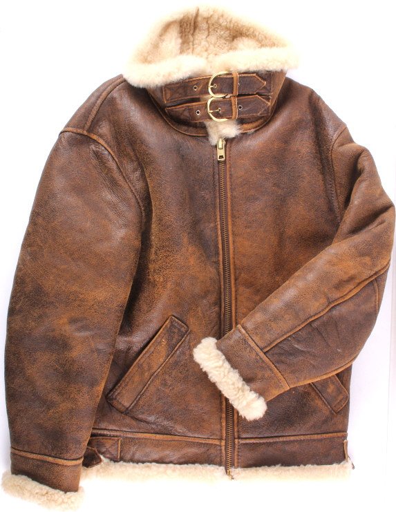 Leather Bomber Style Flight Jacket: This is a leather bomber style flight jacket. The jacket features a leather exterior and is lined with lamb's wool. The jacket is in good condition. It is approximately size large.