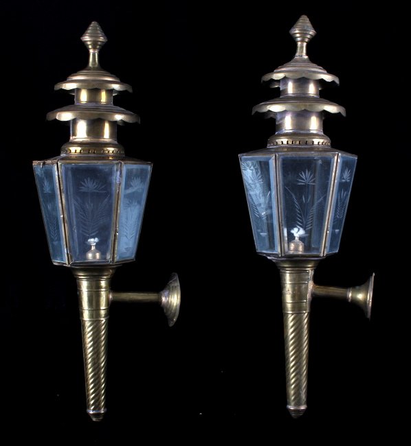 Vintage Brass Carriage Type Wall Mount Oil Lamp: This lot contains a pair vintage brass carriage type wall mount lantern/oil lamp. Lamps are in good condition, a little bent here and there but that just adds to the antique look. There is a tear in t