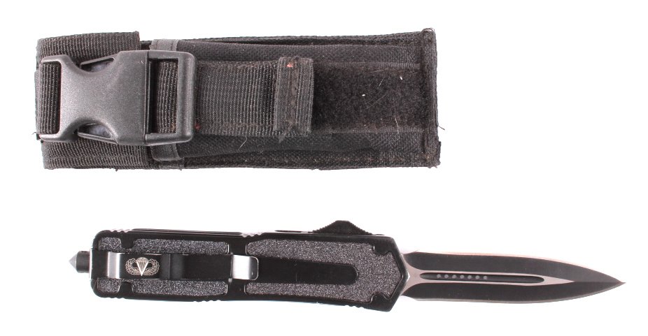 Paratrooper Automatic Knife: This is a paratrooper automatic knife and carrying case. The knife features a double sided blade that extends and retracts automatically with the sliding button on the side. The knife comes with a nyl