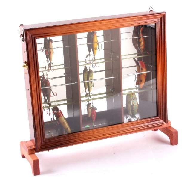 Antique Fishing Lure Collection with Display Case: This is a collection of nine antique fishing lures with a wooden display case. The lures include Heddon, South Bend, Creek Chub, etc. The display case is made from solid wood and features a mirrored b