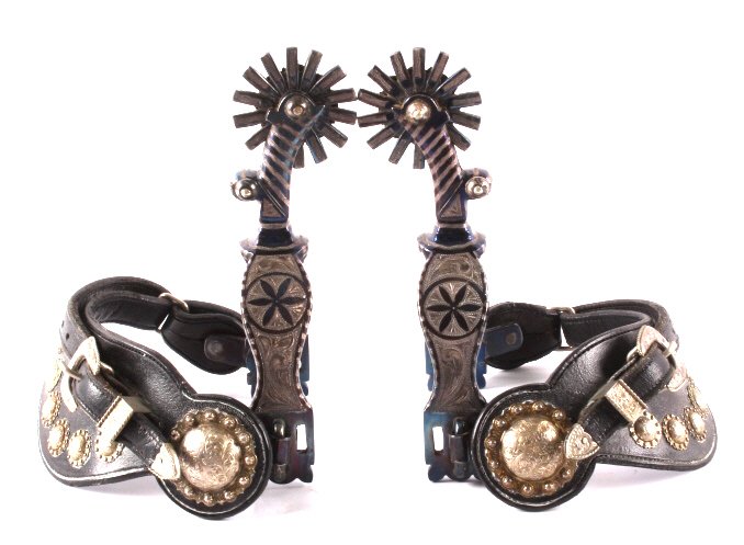 Fleming Silver Mounted Spurs Custom Marked "JFK": This is a pair of Fleming silver mounted spurs and straps. The spurs are marked "Fleming" and each one is monogrammed "J.F.K." as well. The spurs have a beautiful blue finish with silver overlay and i