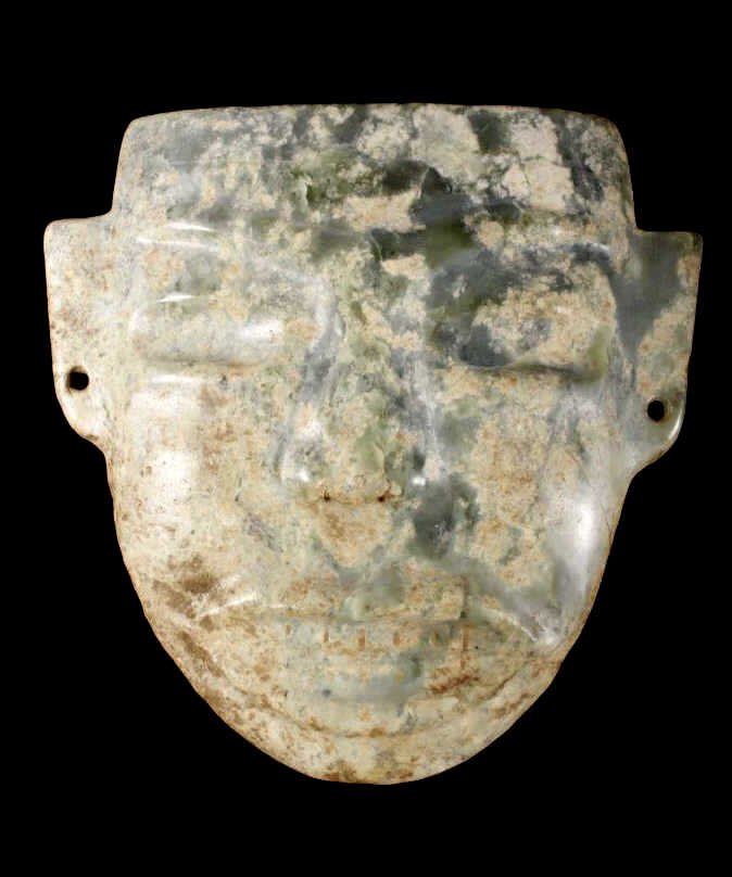 Olmec Pre-Columbian Jadeite Mask 1200-400BCE: This is an excellent carved Jade or Jadeite mask believed to be from the Olmec People. The piece was made by a highly skilled artisan showing a very smooth detail carved area and wonderful symmetry ac
